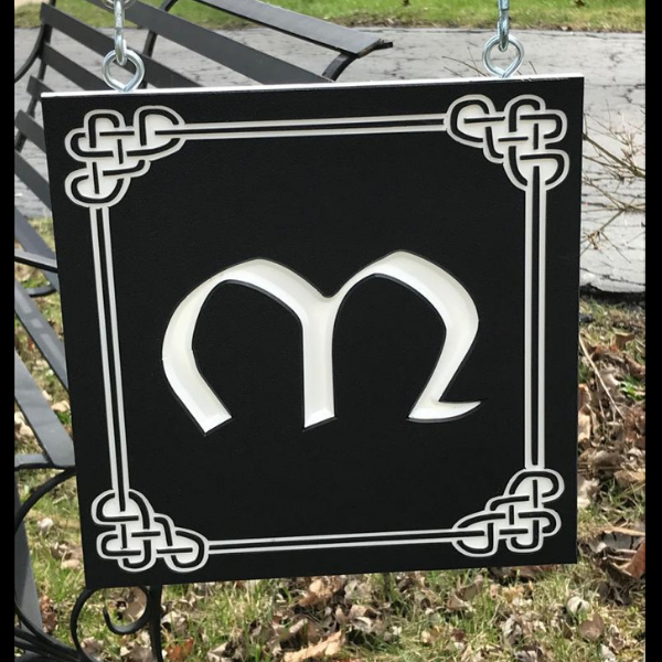 Custom sign with initial M on black-white-black color core