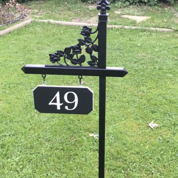 Custom white and black house number sign on one of our black lawn signs with rose scroll