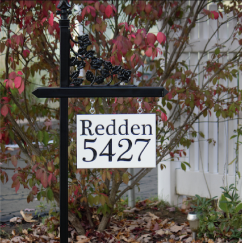 Custom black lawn sign holder with house number with family name on a customized engraved sign made from white-black-white color core. Contact us for details if you're interested in a black lawn sign.