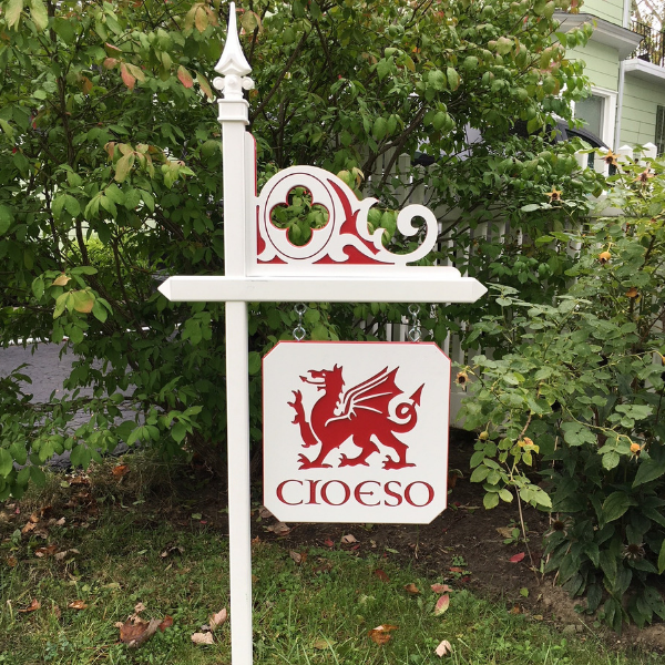 White lawn sign holder with custom red Celtic Corner and red Welsh dragon sign